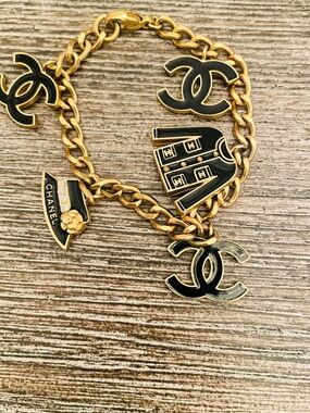 CHANEL Black and Gold Charm Bracelet size 7 inch